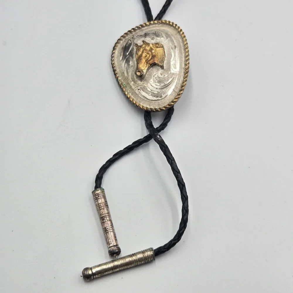 Vtg Southwestern Bolo Tie Silver Gold Tone Horse Head Black Braided Cord‎